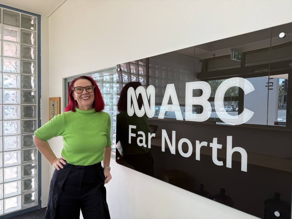 Tracy Sheen beside the ABC Far North sign at the Cairns studio