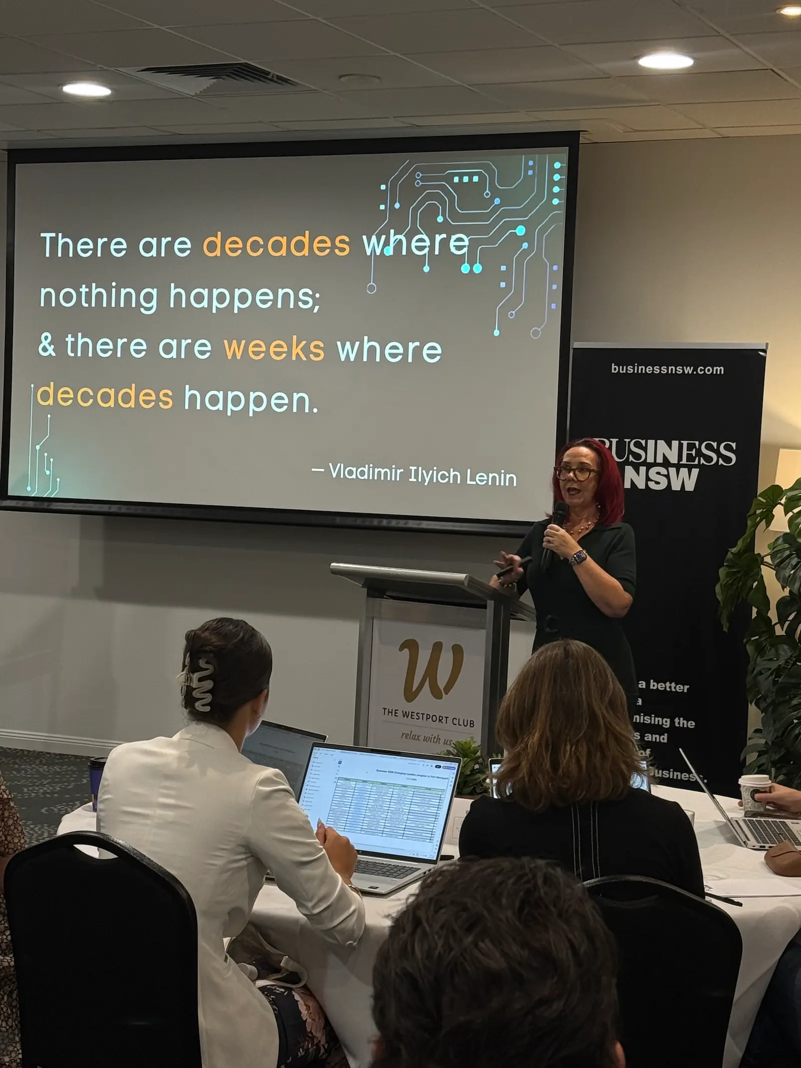 Tracy Sheen presenting at a Business NSW community event, microphone in hand