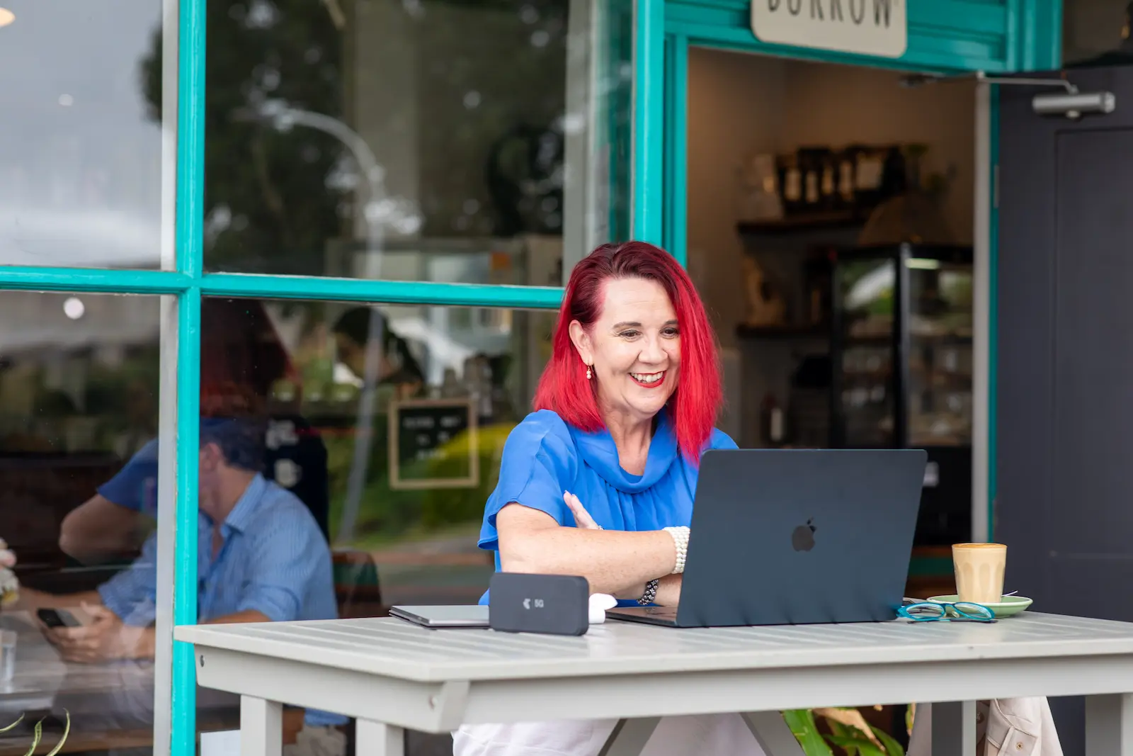 Tracy at desk with laptop