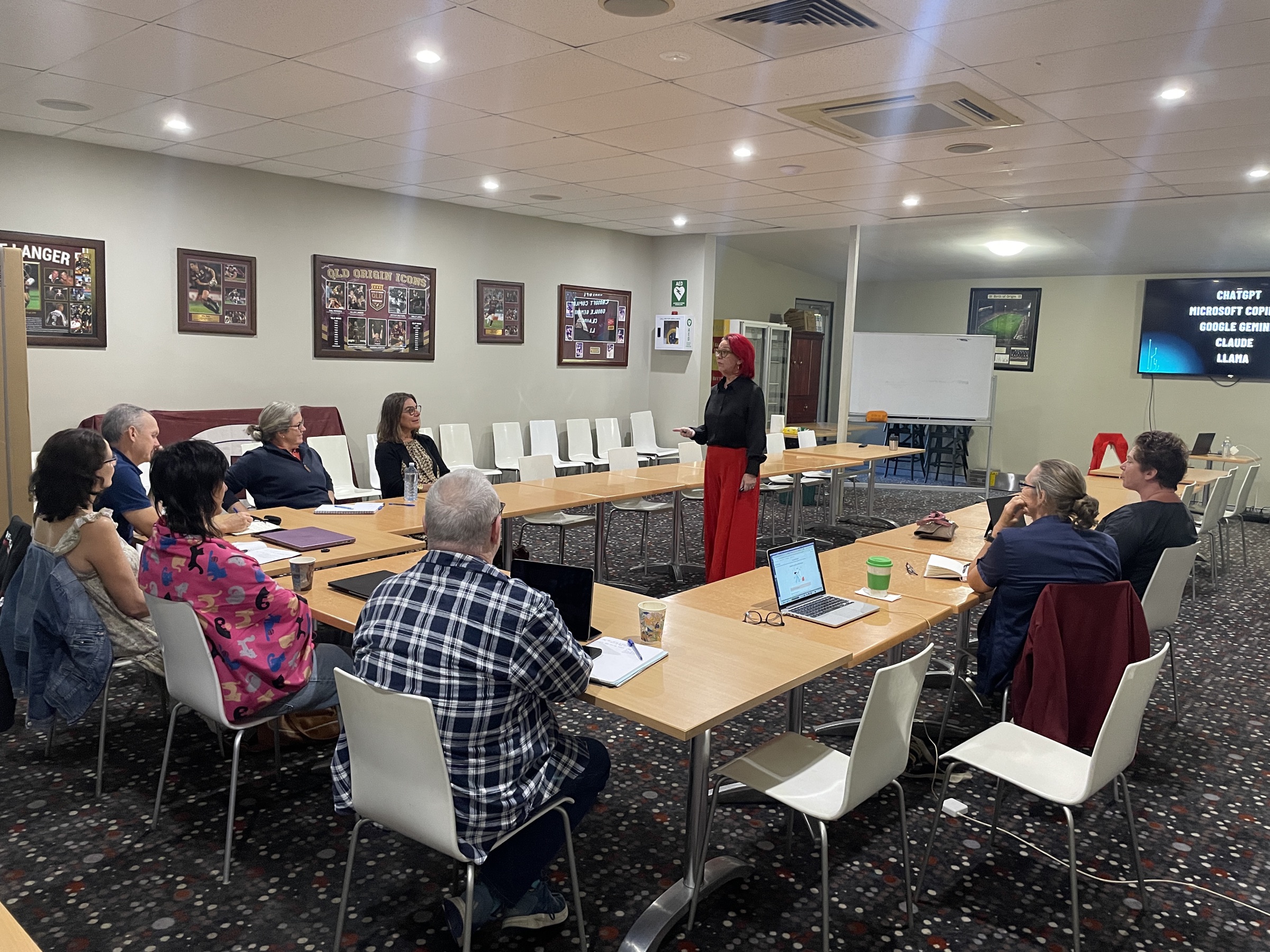 Workshop participants working at tables during the AI Made Simple session in Longreach